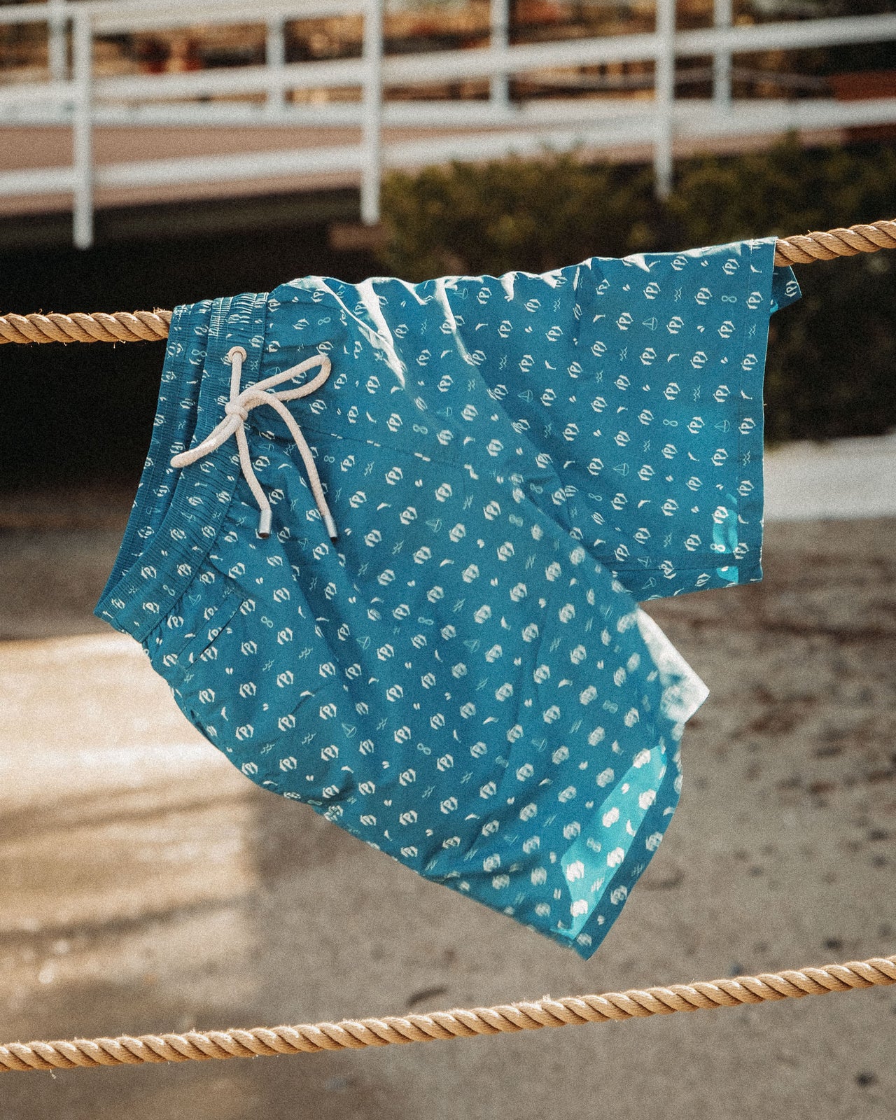 MONOGRAM SWIM SHORTS .