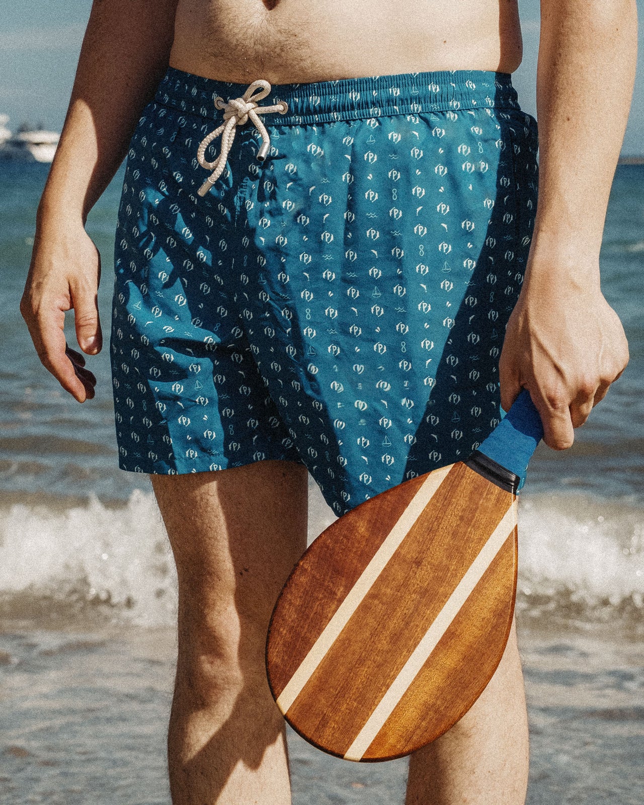 MONOGRAM SWIM SHORTS .